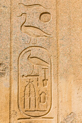 Egyptian hieroglyphs carved in stone. The Karnak Temple Complex, a vast mix of decayed temples, chapels, pylons, and other buildings in Luxor, Egypt