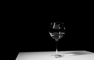 Wine glass on a black background.