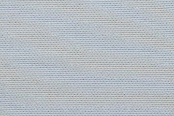 Fototapeta na wymiar The texture of a light knitted sweater fabric. 