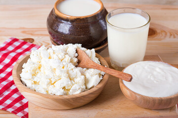 Fresh Cottage Cheese On Wooden Background, Close Up
