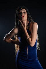 Fototapeta premium Portrait of a natural native, mystery girl wearing braids that looks like an ancient goddess.