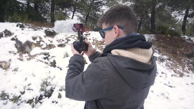 Filming video in the snow. Winter.