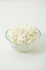 A glass bowl with cotton cheese