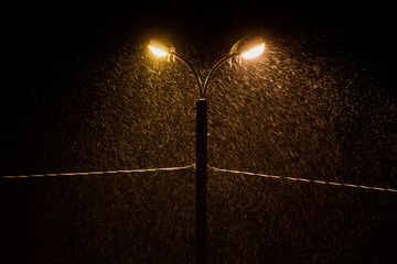 Photograph of a street lamp and snow