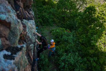 Obraz premium Two mountaineers climbed to the top of the mountain