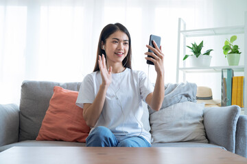 Asian woman making a video call to her friend, Online communication concept.