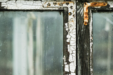 Fragment of an old rotted window frame