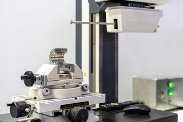 machining part or product set on vise during inspection on surface roughness and contour measuring machine