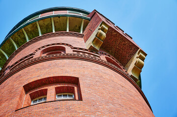 Details of a historic red brick water tower built around 1900 in Berlin, Germany.