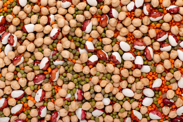 Mixed dried legumes and cereals background, top view. The concept of healthy and nutritious food