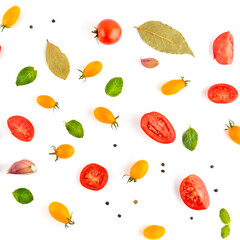 background from cherry tomato, garlic, pepper and bay leaf. Vegetables isolated on white background.