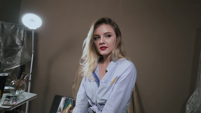 Sexy Blonde Girl Artist in Art Studio