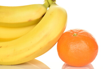 Fototapeta na wymiar Several ripe yellow bananas and one tangerine, close-up, isolated on white.
