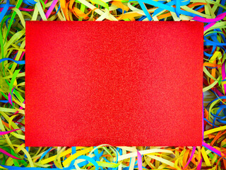Abstract colorful holiday paper ribbons,red rectangle sparkling paper copy space in...