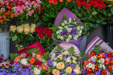 Crop view street sale of flowers. Floristic business. Arrangement of bouquets
