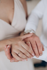 the bride and groom hold each other's hands