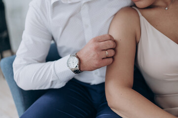 the groom strokes the bride with his hand