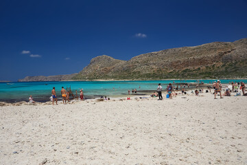 Fototapeta na wymiar The people on the beach of Balos, the Crete island.