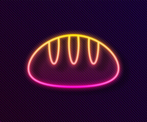 Glowing neon line Bread loaf icon isolated on black background. Vector.