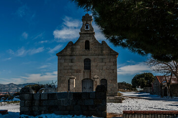 Hermitage of Cerrillo, Galapagar. Hermitage built in stone. Image taken after the passage of the storm Filomena in January 2021