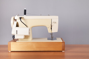 Sewing machine on an isolated table.