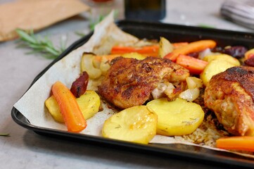 Roasted chicken leg with grilled vegetables potato, carrot, beetroot, onion