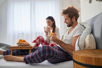 The food a young couple having for a breakfast in the bed at their bedroom is very delicious. Love,...