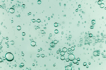 Liquid cream gel, green blue cosmetic texture with bubbles