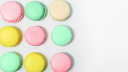 Almond cookies, in pastel colors on a white background. Traditional French multicolored dessert, close-up. he view from the top
