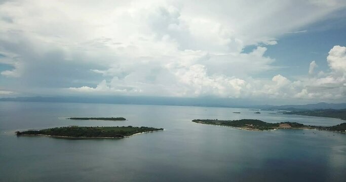 aerial seascape, tropical vacation and island hopping concept. Gilli air island and Lombok . Indonesia, south Gili islands. Gili Asahan island. A strip of sand on the beach and blue sea with corals