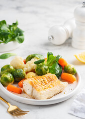 Cod fillet with vegetables. Healthy food. Selective focus.