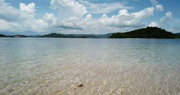 aerial seascape, tropical vacation and island hopping concept. Gilli air island and Lombok . Indonesia, south Gili islands. Gili Asahan island. A strip of sand on the beach and blue sea with corals