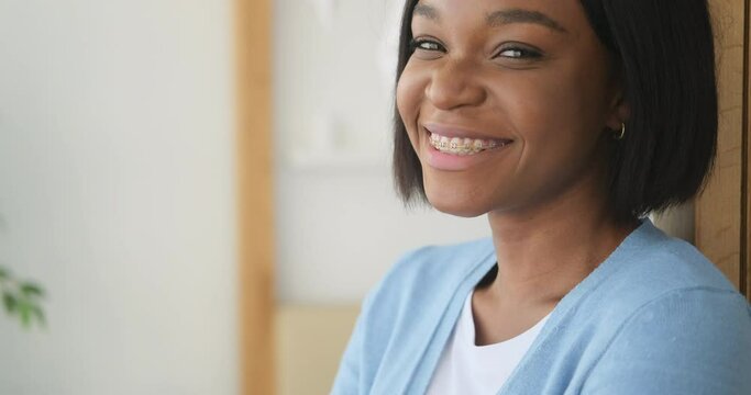 African american woman smiling with braces on teeth