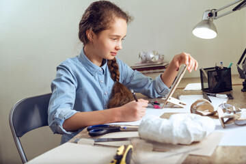 Girl student teenager studying online using smartphone, video conferencing, videocall, distance education, learning at home.