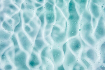 Liquid cream gel, green blue cosmetic texture with bubbles