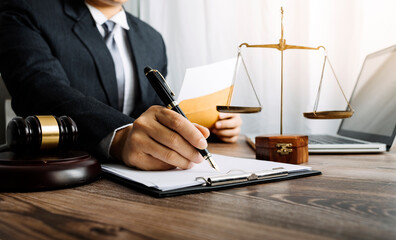 justice and law concept.Male judge in a courtroom on wooden table and Counselor or Male lawyer...
