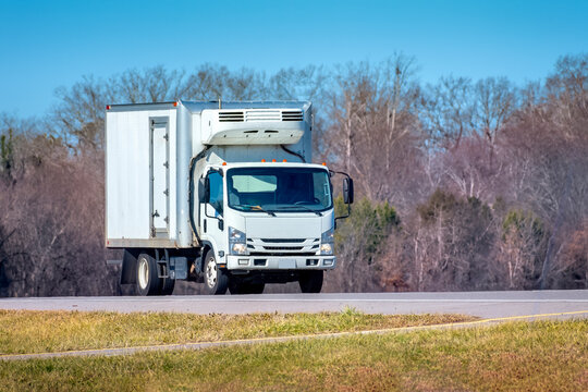 Generic White Refrigerated Delivery Truck On Roadway