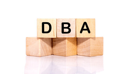 DBA acronym from wooden blocks with letters, DataBase Administrator or doing business as abbreviation DBA concept