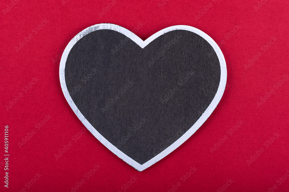 Wall mural black chalkboard with heart shape on red background. free copy space. concept valentine's day. conce