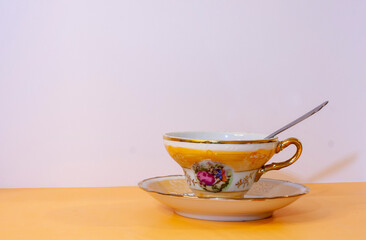 Cup of coffee with saucer and spoon