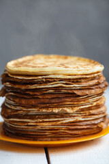 Shrovetide Maslenitsa Butter Week festival meal. Stack of russian pancakes blini. Rustic style, close up view