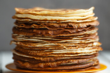 Shrovetide Maslenitsa Butter Week festival meal. Stack of russian pancakes blini. Rustic style, close up view