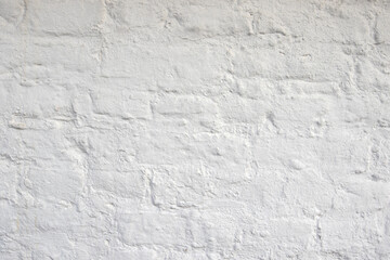 Close up of an old red orange brown worn and weathered brick wall. Masonry clinker bricks clinker bricks, Brick paint over with the color white. texture