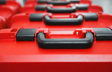 Red packing plastic boxes cases for geodetic total stations. Geodetic instrument boxes lined up....