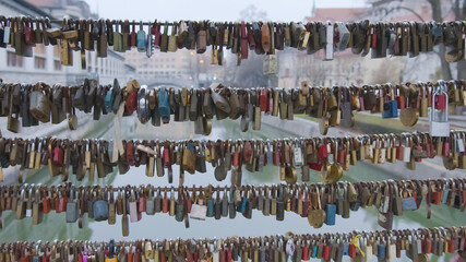 Love locks locked on the fence of the bridge in Ljubljana, Slovenia