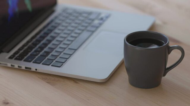 working on laptop and drinking cofee computer cup business office keyboard notebook drink work desk internet table break white technology espresso cafe mug pc breakfast tea home working morning