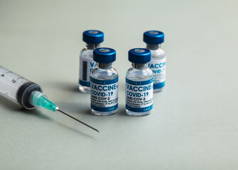 Covid-19 Corona Virus 2019-ncov vaccine vials medicine drug bottles syringe injection. Vaccination, immunization, treatment to cure Covid 19 Corona Virus infection. Healthcare And Medical concept.