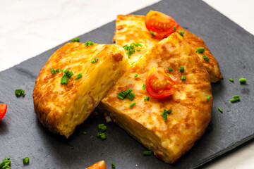 Spanish tortilla with tomatoes and chive