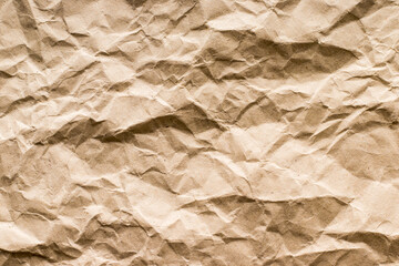 Textured surface of wrinkled yellowish paper