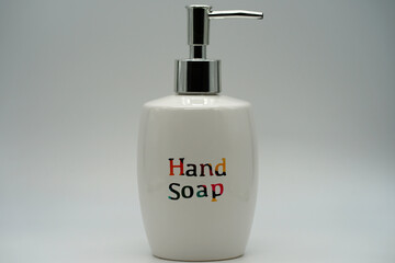 Obraz premium Hand soap in a white ceramic push pump bottle